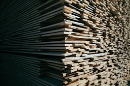 A neat stack of polished wooden planks ready for crafting.