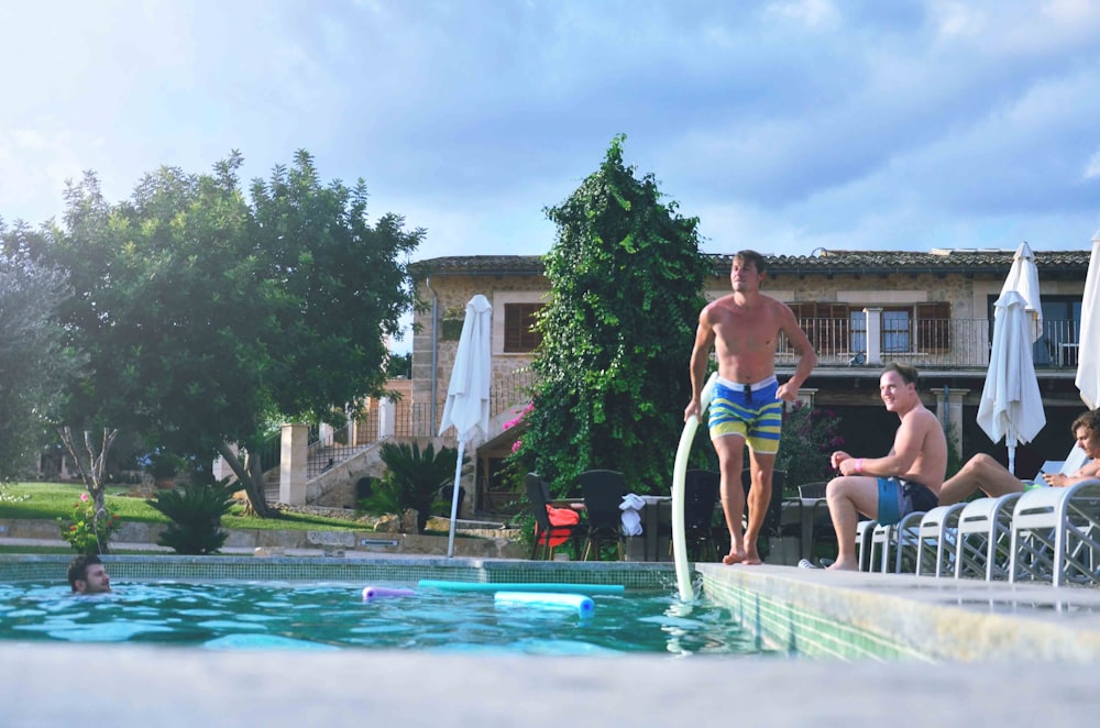 man about to jump on pool