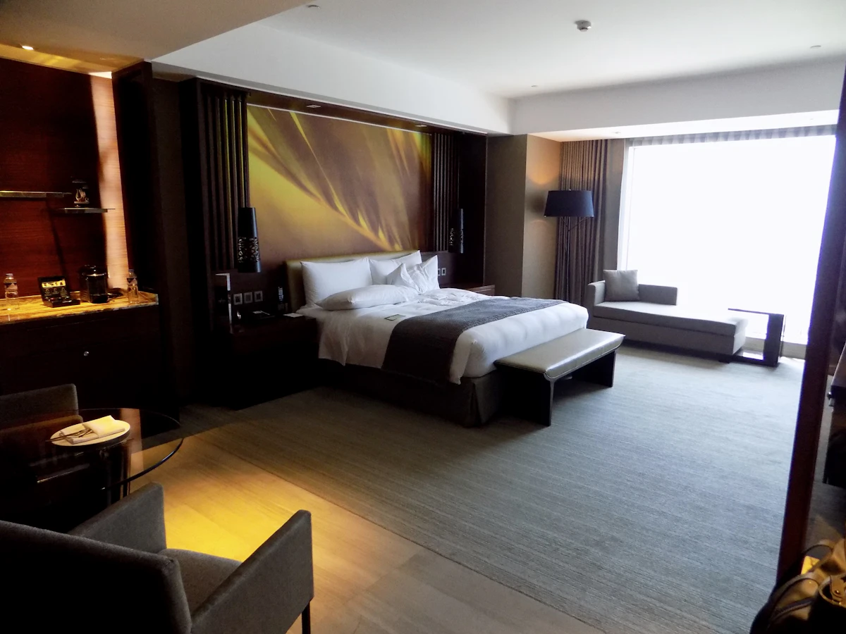 Luxury hotel bedroom with comfortable bed and premium amenities