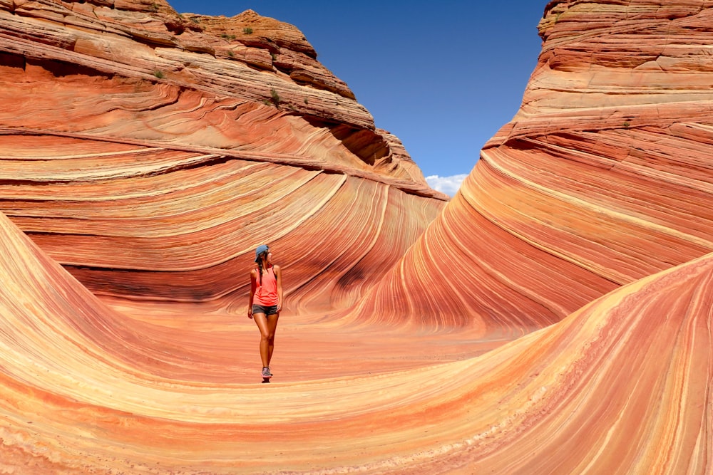 woman walking near canyon