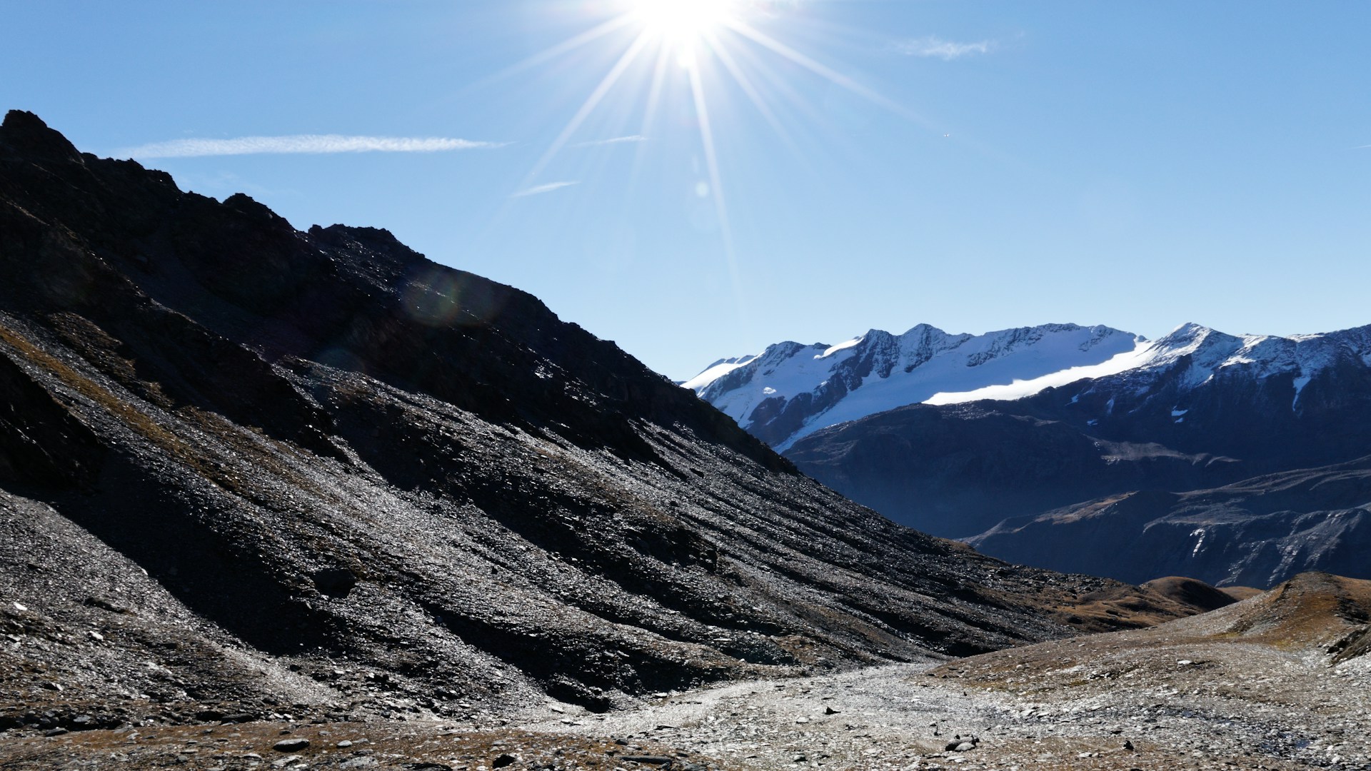 woman wearing yellow long-sleeved dress under white clouds and blue sky during daytime