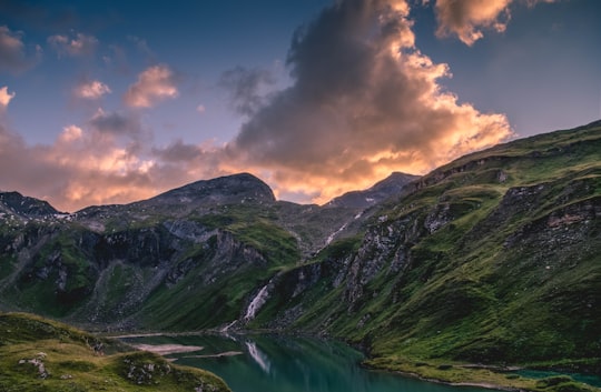 aerial view photography of river between mountain under commulus clouds in Grossglocker Austria