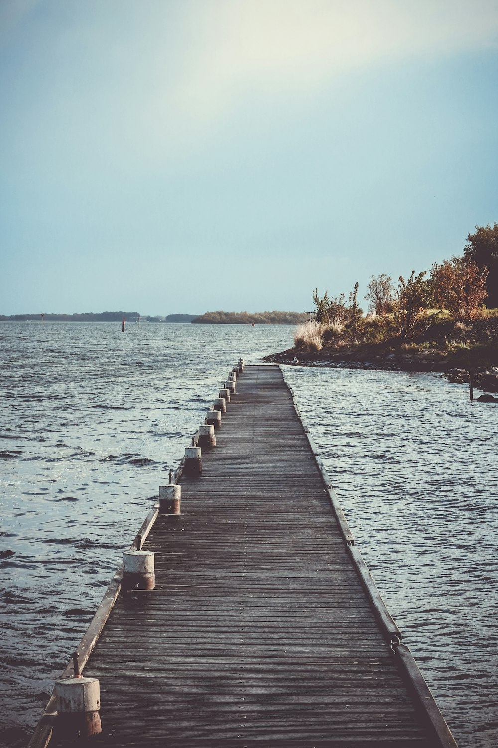 a long dock stretches out into the water