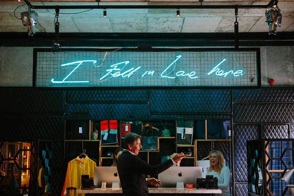 a man and a woman standing in front of a store