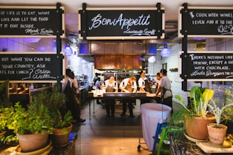 a group of people standing in front of a restaurant