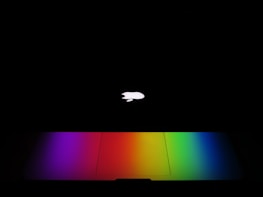 Quantum computing hardware glowing softly against a dark background with subtle motion effects.