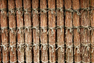 A bundle of strong, braided paper ropes arranged on a wooden surface