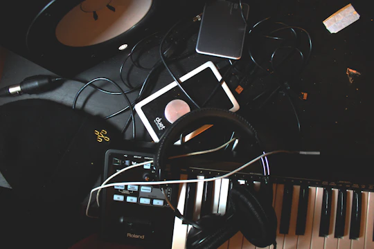 A cluttered desk with tangled cables being organized.