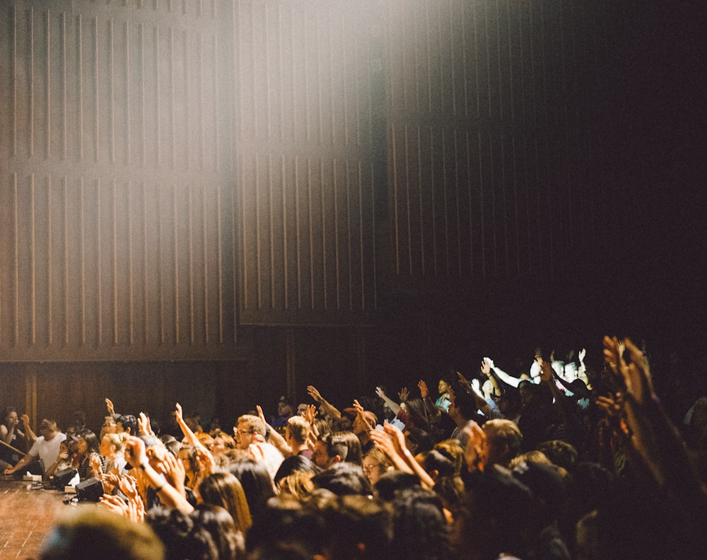 people raising their hands