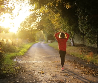 woman walking on pathway during daytime