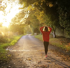 woman walking on pathway during daytime