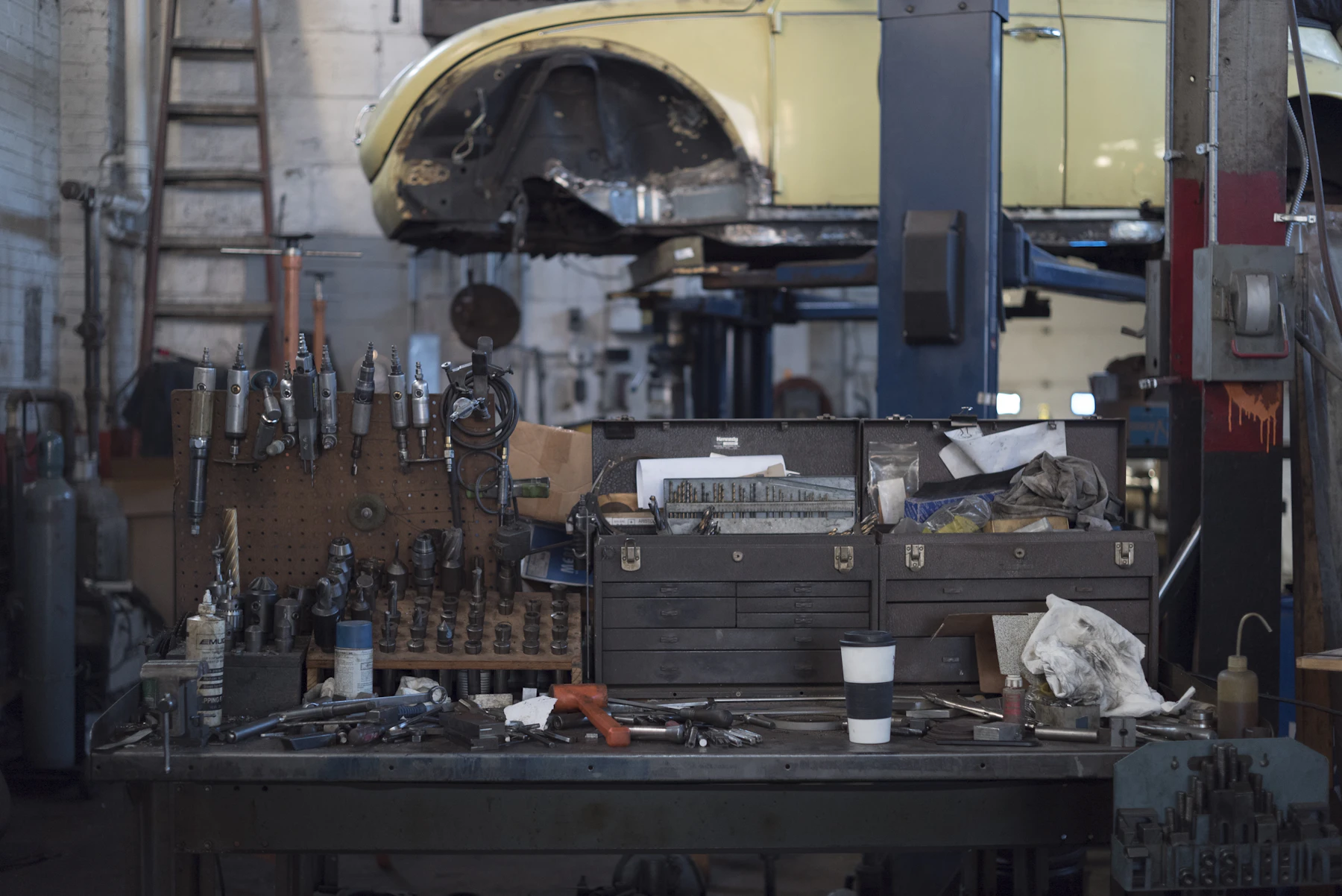 Real workshop workbench with hand tools and practical equipment