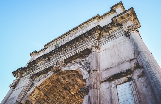 low angel photography of concrete mansion in Arch of Constantine Italy