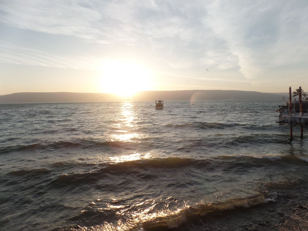 A sunset in the horizon in an ocean in Israel.