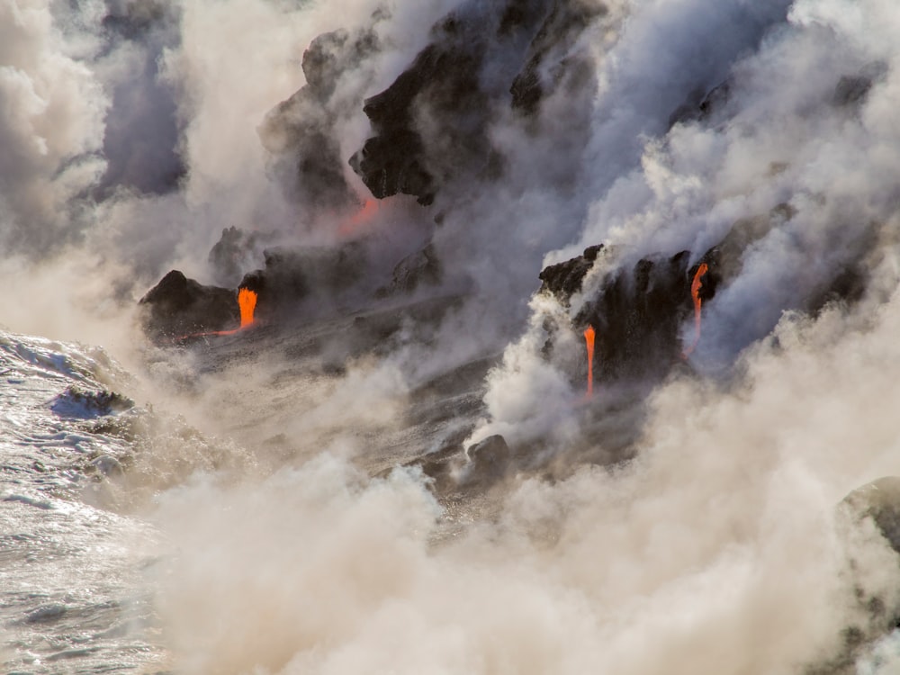 photography of volcanic eruption during daytime