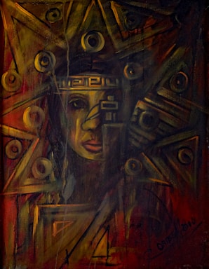 An abstract painting featuring a human face partially obscured by geometric shapes and circular patterns. The artwork incorporates a blend of dark and warm colors, creating a mystical and enigmatic atmosphere. The use of triangular and circular elements suggests a complex structure or headdress.