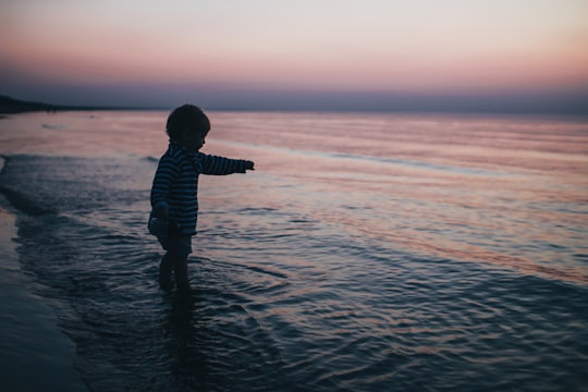 toddler on shore in Jūrmala Latvia