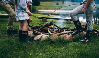 family camping near body of water during daytime