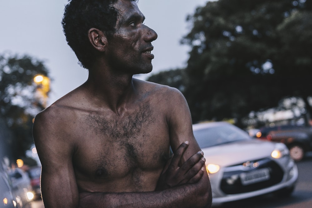 shallow focus photography of man in road during daytime