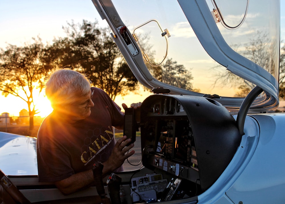 man holding car's side mirror during daytime