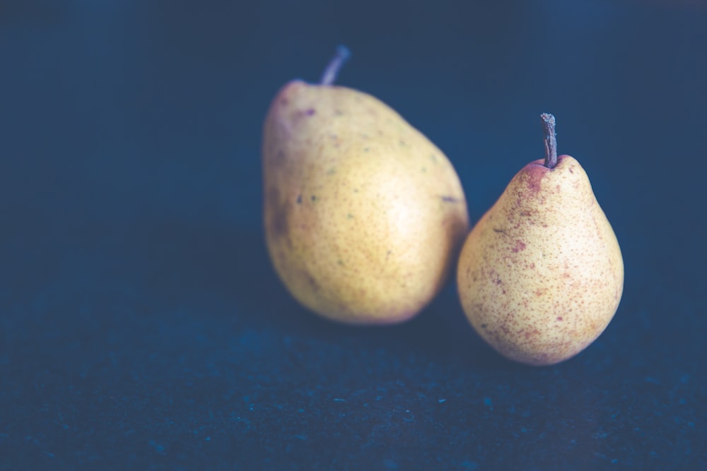 filtered photography of two pear fruits