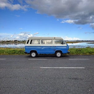 A medium-sized blue van ready for a weekend trip.