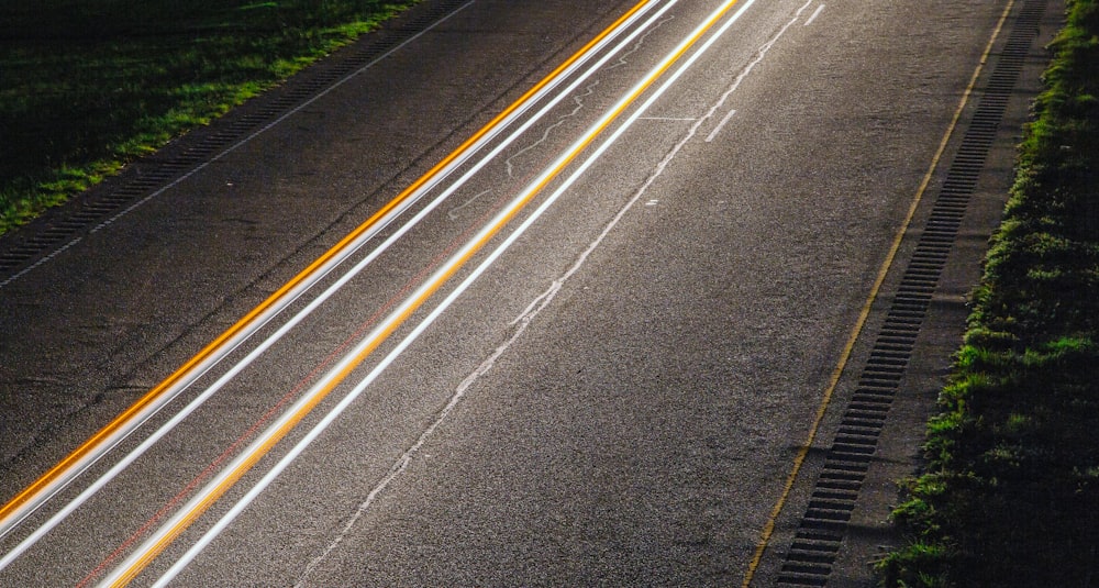 panning photo of light on road