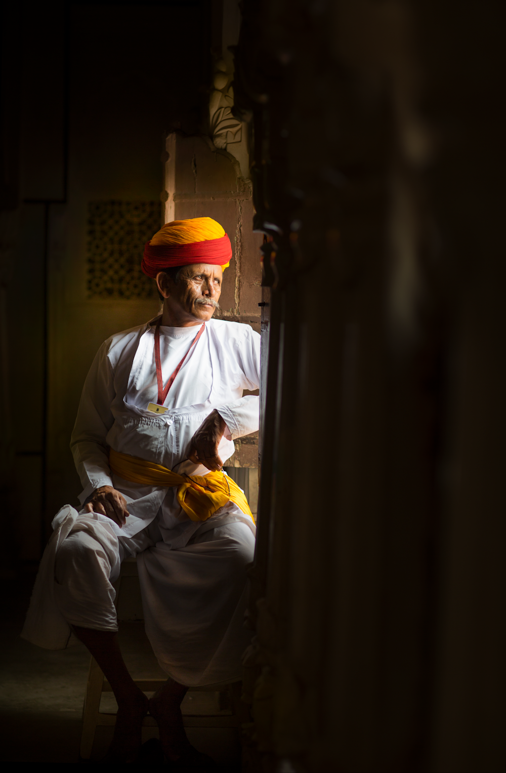 man leaning on open window