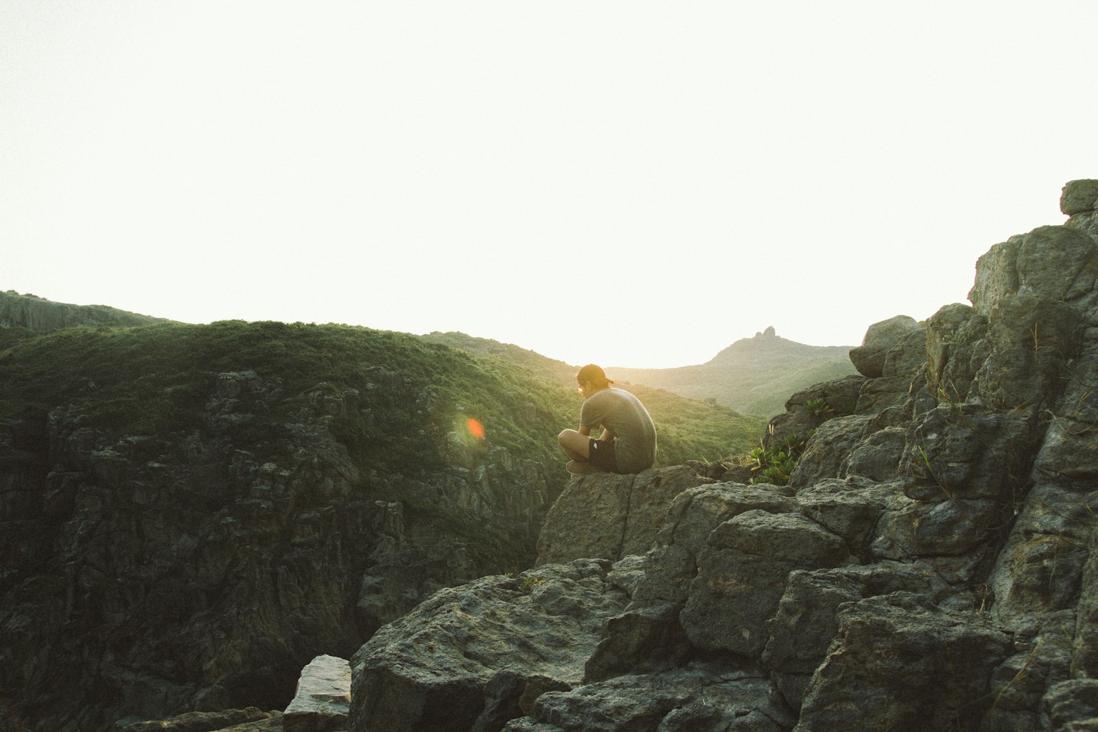 Tamron SP AF 17-50mm F2.8 XR Di II LD Aspherical (IF) sample photo. Man sitting near cliff photography