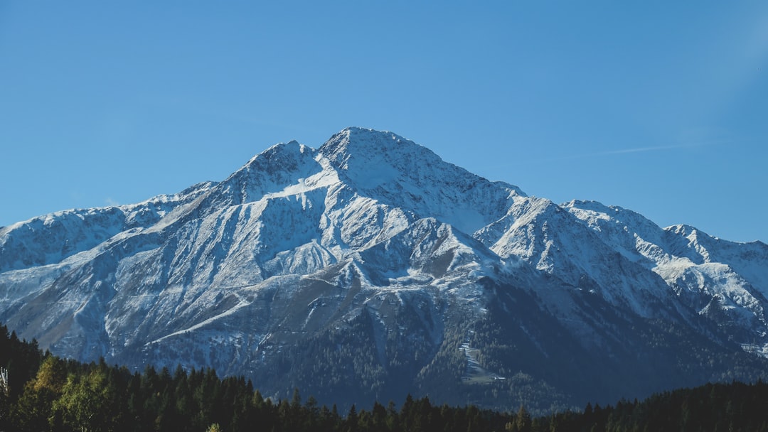 snow covered mountain during daytime