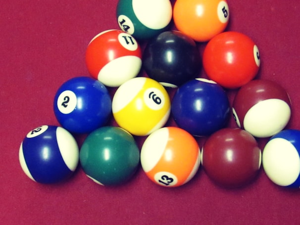 A vibrant billiard table with colorful balls arranged for a game.