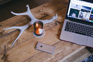 MacBook Pro beside space gray iPhone 6