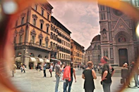 A vibrant collage showing travelers exploring European landmarks, engaging in cultural exchanges, and attending professional workshops.