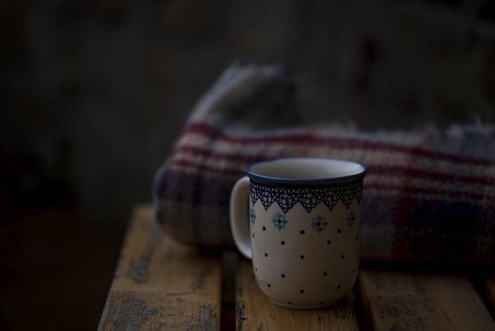 white and blue coffee mug