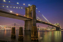 Brooklyn bridge with lights at night time