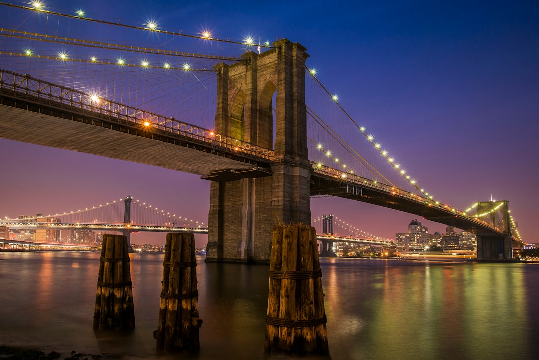 Brooklyn bridge with lights at night time