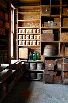 Tidy storage room with labeled boxes and wooden shelves in soft light