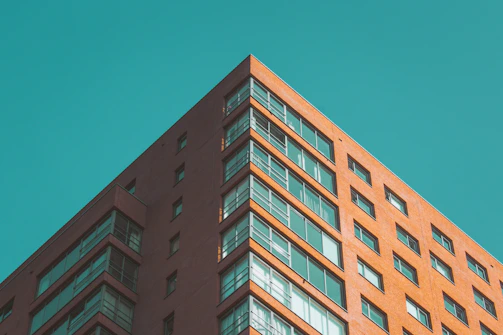 Chicago skyline view with red accents highlighting a modern apartment building.