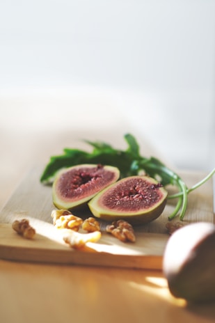 Sliced in half oval green fig fruit 