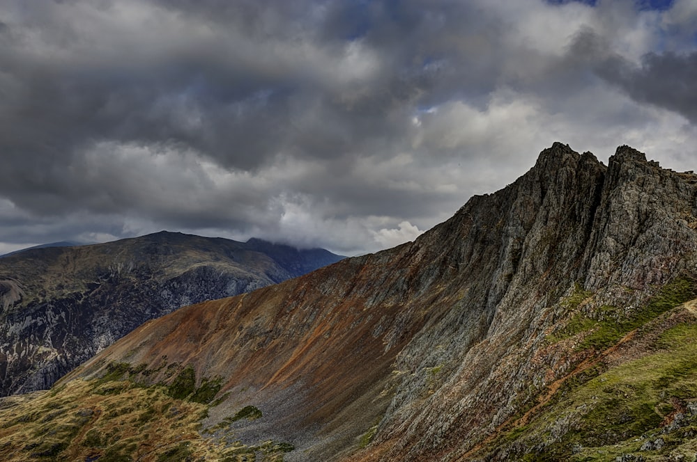 photography of brown and green mountain range