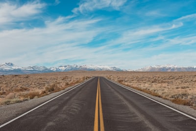 gray concrete road under blue sky during daytime road google meet background