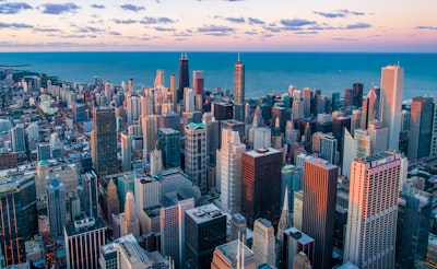 white and brown city buildings during daytime city google meet background