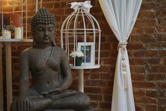 A serene meditation corner with a cushion, incense, and a small statue of Buddha.