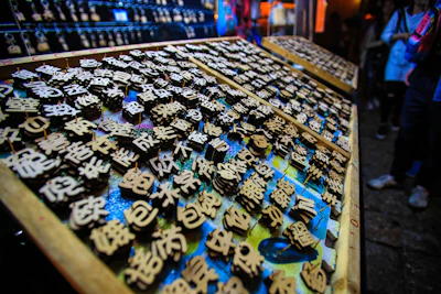 Traditional block printing tools arranged on a wooden table in the workshop.