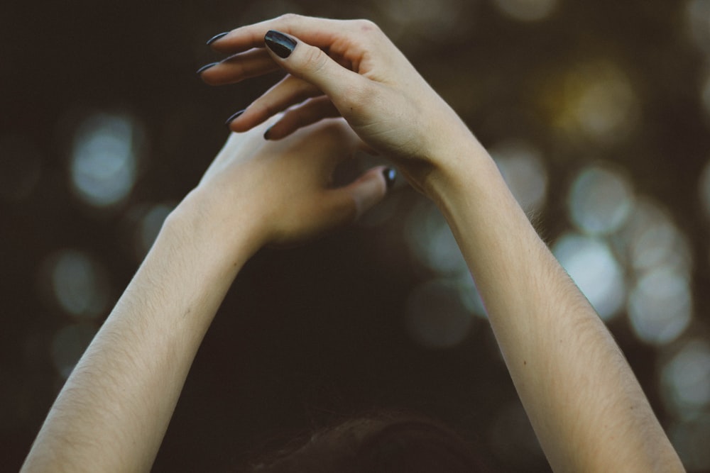 person with black nail polish