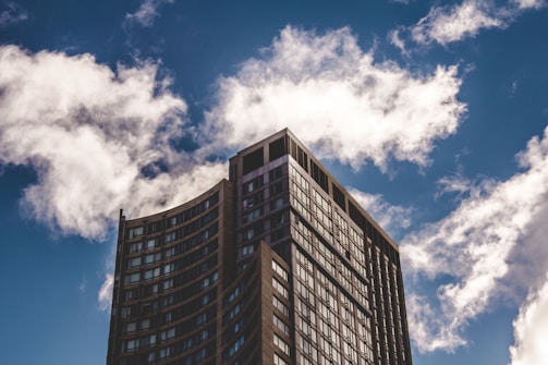 A modern residential building in Chennai with clear blue skies, highlighting Krish Associates' urban projects.