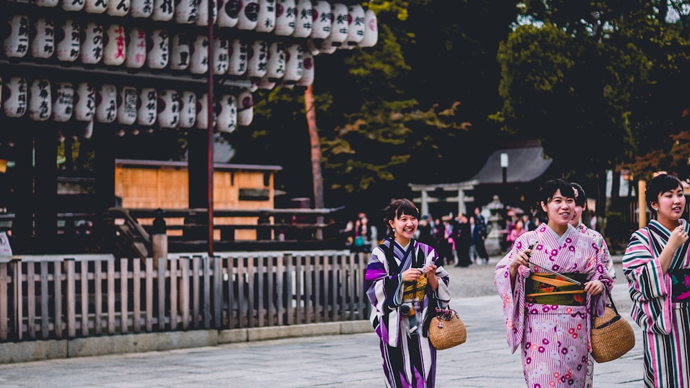 A group of women in colorful kimonos in Kyoto Prefecture.