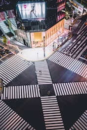 A vibrant city intersection with solar-powered traffic lights and interactive metro maps.