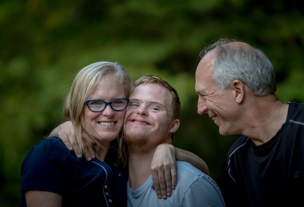 Family laughing together outdoors
