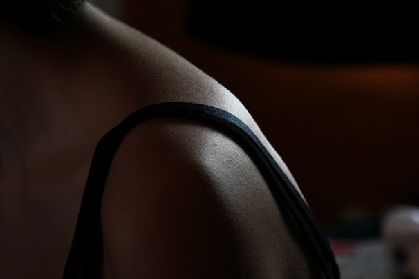 A close-up of a posture corrector being worn over clothing.